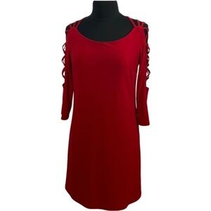 Cartise shift dress with gorgeous long sleeve cut-out design. Size 6